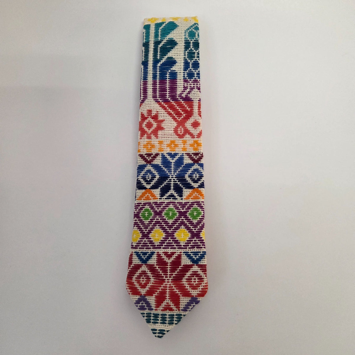 Fiesta Style 6 huipil tie with teal, blue, red, purple and yellow patterns